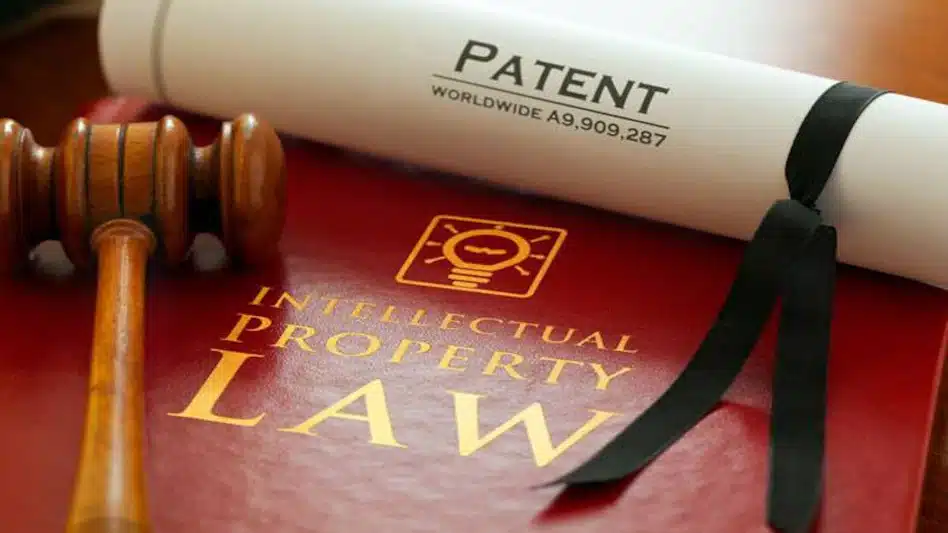 Gavel on intellectual property law book with a patent certificate.