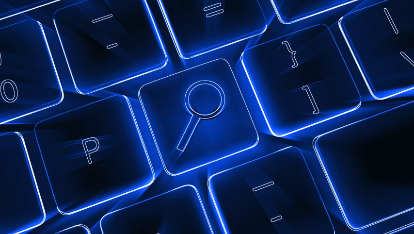 Glowing blue search key on a computer keyboard.